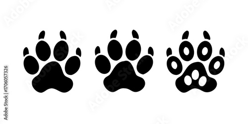Different animal paw print vector illustrations .Sixteen black paw print icons each with a different animal silhouette inside vector illustration
