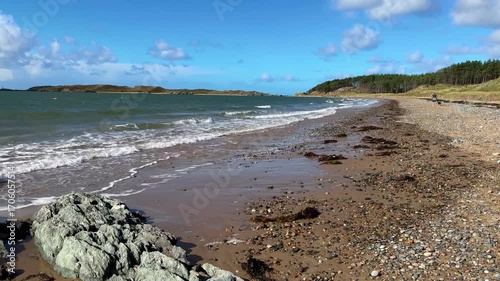 The beach at Newborough Warren and Llanddwyn Bay on the Isle of Anglesey in Gwynedd off the north Wales coast.