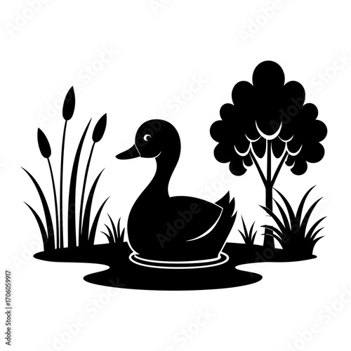 Black silhouette of a duck in a pond with reeds and tree
