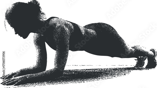 A woman performing a plank exercise, showcasing strength and fitness in a workout setting.