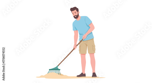 Smiling bearded man in a blue tshirt and shorts doing yard work with a rake.