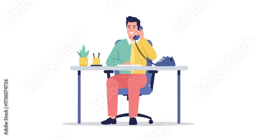 Smiling businessman sitting at an office desk while talking on a landline telephone.