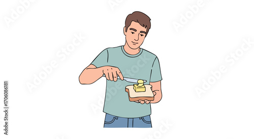 Young man in a casual tshirt spreading yellow butter on a slice of bread with a knife.