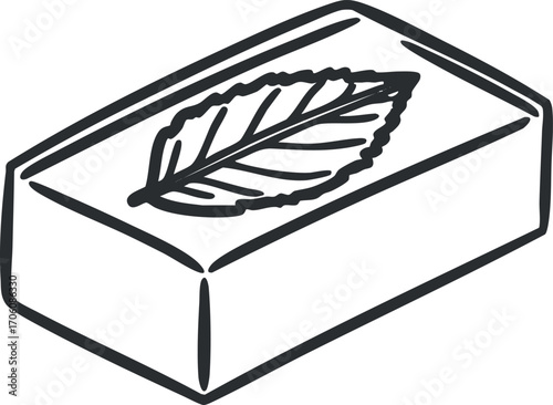 Illustration of a bar of soap with a leaf design emphasizing natural and organic qualities.