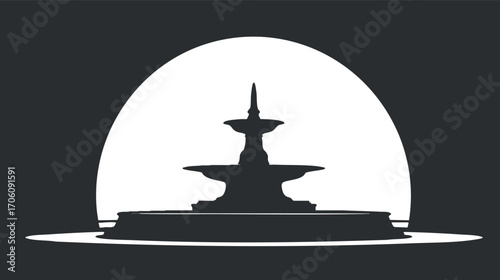 Silhouette of a fountain against a circular backdrop creating a serene urban landscape.