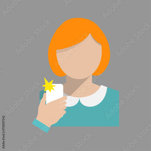 Redhead woman holding a mobile phone taking a self-portrait with a bright camera flash