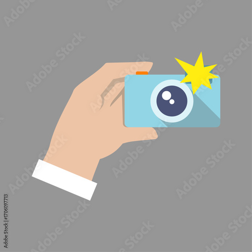 Illustration of a hand holding a compact camera capturing a memory with flash
