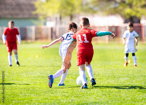Football match between children in sports field