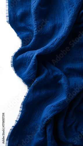 Dark blue fabric with visible wrinkle texture.