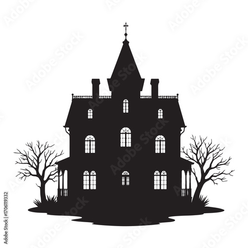 Silhouette of a spooky victorian haunted house with bare trees