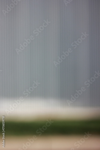 A dreamy view of a striped metal background.