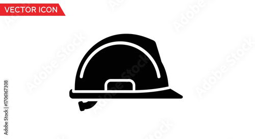 Black construction helmet protecting from falling objects in industrial workplace, symbolizing safety and precaution.