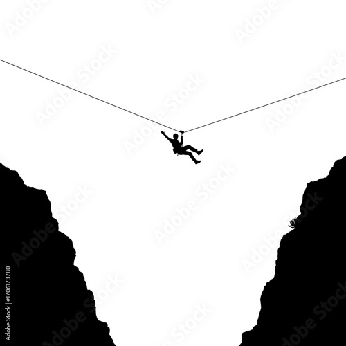 Silhouette of a person ziplining across a deep canyon with dramatic dark rocky cliffs against a bright white sky