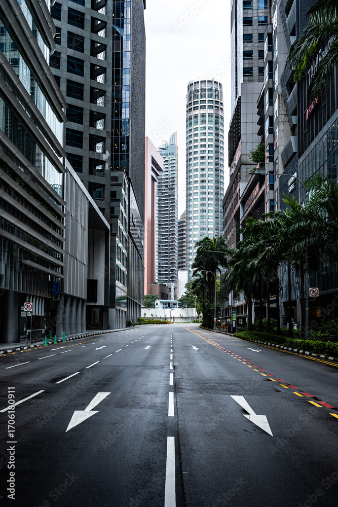 Fototapeta premium Empty asphalt road between modern buildings in singapore