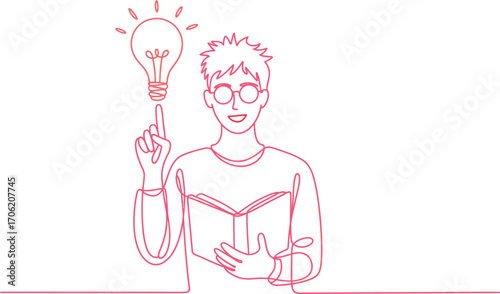 Young man with glasses points to a glowing lightbulb above his head while reading a book, symbolizing inspiration and knowledge.