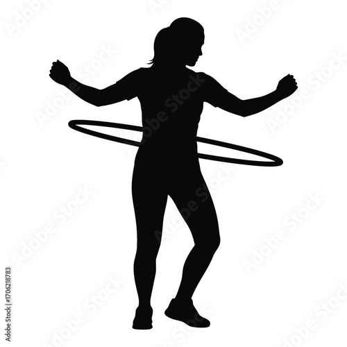 Silhouette of a woman hula hooping energetically demonstrating fitness and fun silhouette