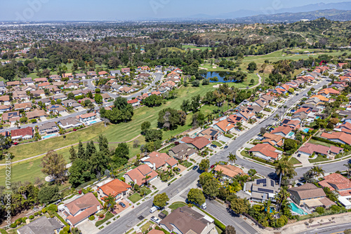 Fullerton, Orange County, CA, California, May 7, 2024: Aerial Drone City View Los Coyotes Country Club, Golf Property, Golf-Front Homes, Townhouse, Houses, Streets
