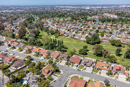 Fullerton, Orange County, CA, California, May 7, 2024: Aerial Drone City View Los Coyotes Country Club, Golf Property, Golf-Front Homes, Townhouse, Houses, Streets
