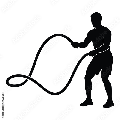 Silhouette of man exercising with battle ropes for intense workout training silhouette