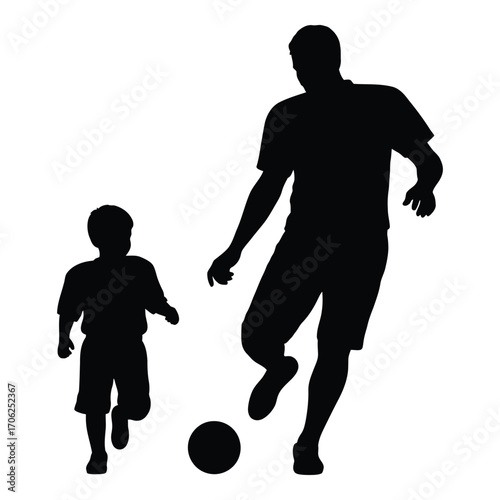 Father and son silhouettes playing soccer together enjoying family bonding time outdoors silhouette