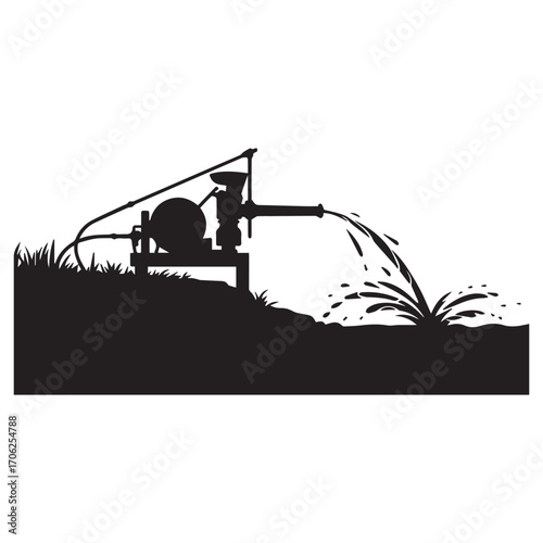 Silhouette of an agricultural water pump spraying water onto a field with grass and plants in the foreground