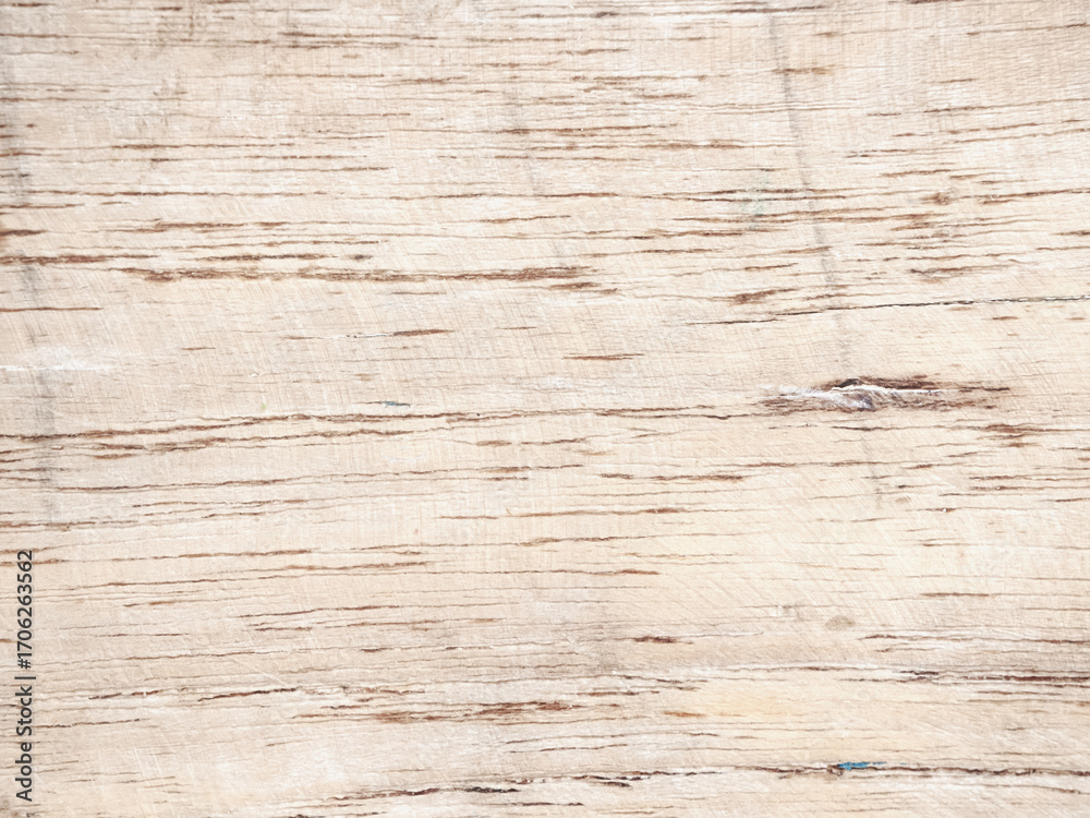 Naklejka premium Close-up of a weathered wooden surface revealing natural grain patterns and textures.