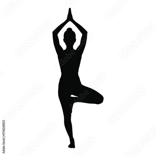 Silhouette of person performing tree pose yoga exercise demonstrating balance and serenity silhouette