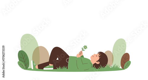 Peaceful Person Enjoying Nature Lying Down in the Meadow Holding a Flower