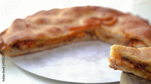 Empanada gallega, a delicious Spanish savory pie filled with tender onion, pepper and tomato and octopus