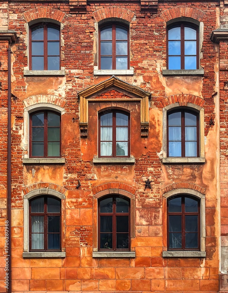 Fototapeta premium Facade of a weathered brick building
