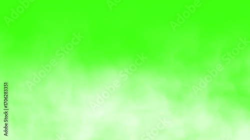 White fluffy wispy clouds of white smoke or dry ice fog moving camera left to right on a green screen chroma key background 4K