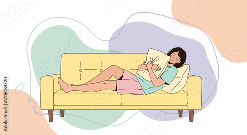 Relaxing Young Woman Laying On A Couch Embracing A Pillow in a Peaceful Pose