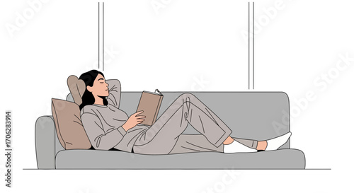 Restful Reading: A Woman Lounging On A Couch Immersed In A Book At Home