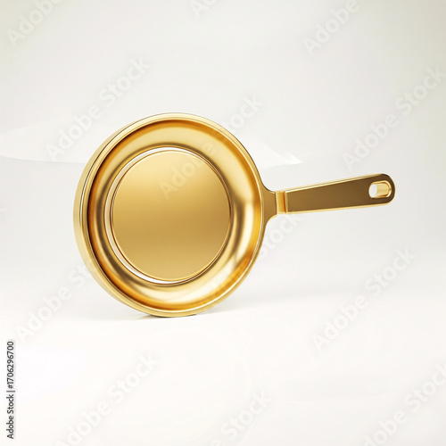 A golden frying pan with a shiny smooth surface,
