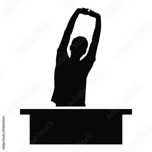 Silhouette of person stretching arms upward over a rectangular object silhouette