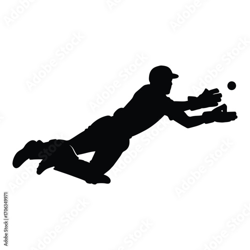 Silhouette of a cricketer making a diving catch in action silhouette