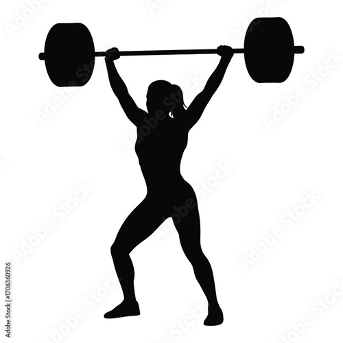 Silhouette of athletic woman performing overhead weightlifting exercise strength training fitness silhouette