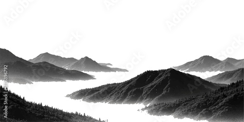 A stunning landscape of a misty mountain range with sunlit peaks and snow-covered hills