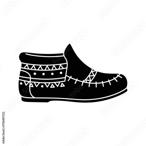 Vector art of black silhouette of an ethnic moccasin a simple vector illustration of a tribal shoe for fashion or cultural event
