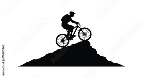a cyclist conquers rocky terrain under clear skies