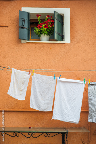 Colorful houses on the island of Burano, drying laundry