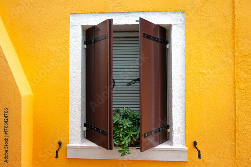 Colorful houses on the island of Burano, drying laundry