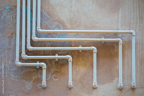 Pipes sticking out of the wall in Italian houses