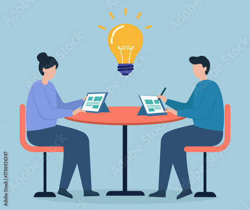 Two teammates co-create ideas at a digital table, sparking innovation under a glowing bulb of shared creativity