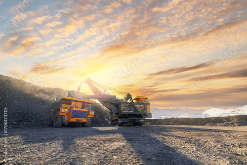Cuadro en lienzo Open-pit coal mining in winter sunset landscape