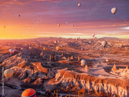 Canvas-taulu Amazing Cappadocia beautiful landscape with hot air balloons at sunrise, aerial