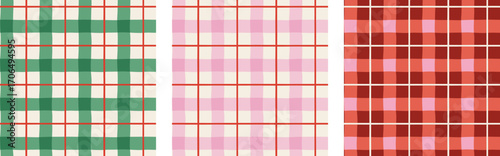 Christmas patterns set. Merry Christmas backgrounds, seamless patterns. Plaid, Checked pattern design. Red, green and pink Xmas colors
