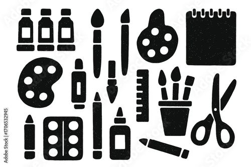 Art supplies arranged creatively, showcasing a variety of tools for artistic expression and design projects in a workspace setting