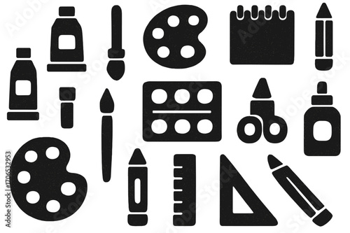 Creative art supplies for children located in a classroom, featuring paints, brushes, scissors, and coloring tools arranged on a surface