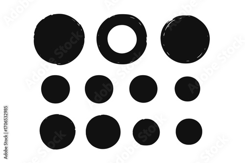 Black circles of various sizes arranged in a grid pattern for design or illustration purposes